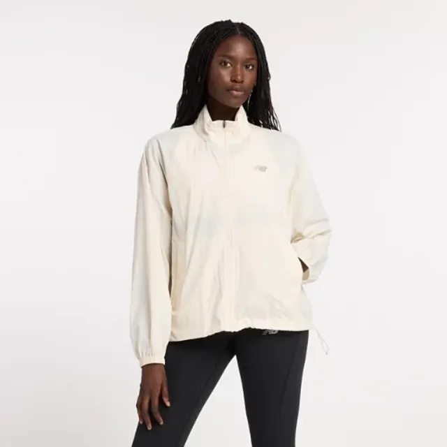 New Balance Women's Athletics Packable Jacket in Beige Polywoven